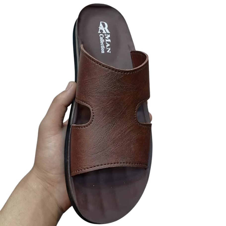 Brown sandal held by a hand on a white background