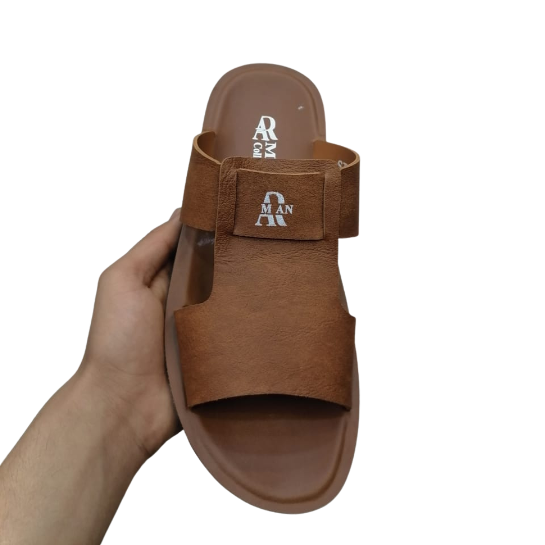 Mustard sipper held by a hand on a white background